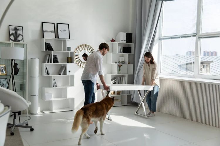 couple moving white desk