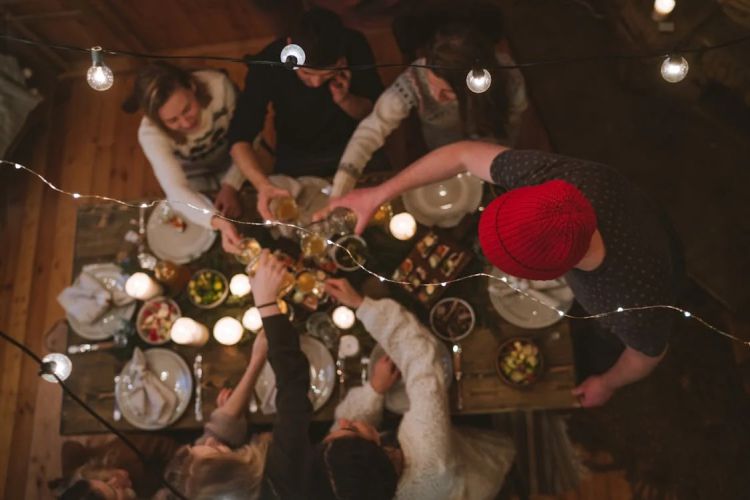 top view of people celebrating under string lights