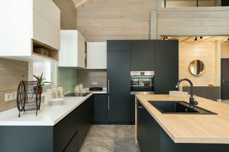 kitchen with matte black cupboards and built-in appliances